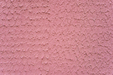 Pink background with wavy patterns on the wallの写真素材
