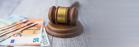 money with wooden judge tableの写真素材