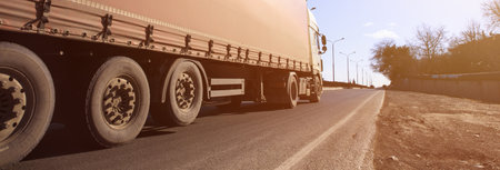 truck in road at sunsetの写真素材