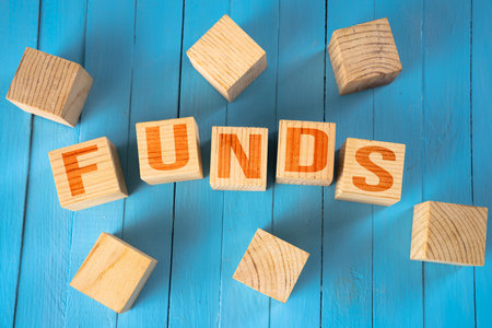 The inscription funds in cubes on the tableの写真素材