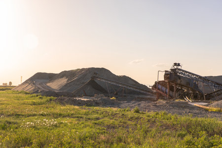 Heavy equipment works during the day at a sand processing quarryの写真素材