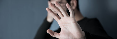 man hand in face and stop sign
