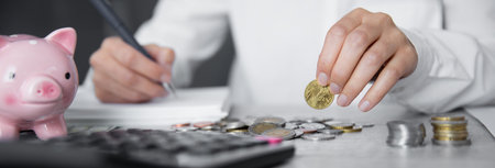 man hand coins and calculator on deskの写真素材
