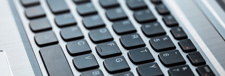 Closeup image of modern laptop computer keyboard