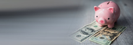 piggy bank with money on deskの写真素材