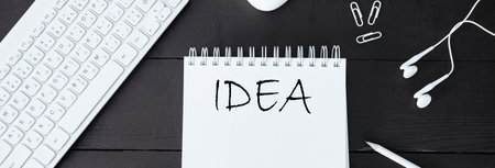 idea text on notepad with stationary on deskの写真素材