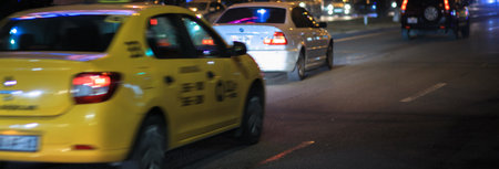taxi in night light cityの写真素材