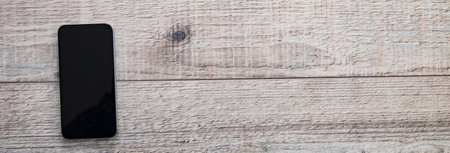 smart phone on wooden deskの写真素材