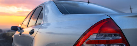 car in road at sunsetの写真素材