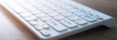 white computer keyboard on desk