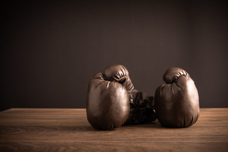 Boxing gloves on the table in the roomの写真素材