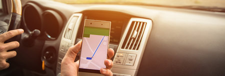 Man Driving Car Hand Smart Phone With Mapの写真素材