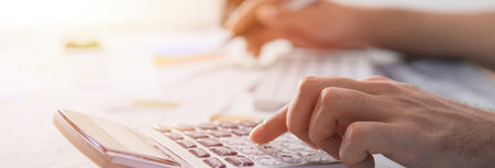 man hand calculator with document on deskの写真素材