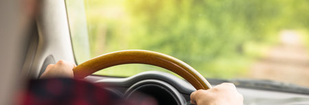 man driving car in natureの写真素材