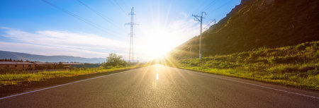 road with sunset and green grass