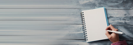 woman hand pen with notepad on deskの写真素材