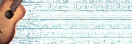 guitar on the blue wooden desk background