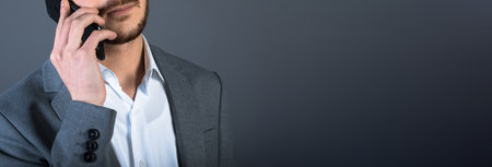 business man speak phone on dark backgroundの写真素材
