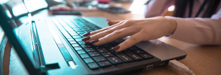 woman working in computer on the deskの写真素材