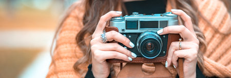 woman hand vintage camera in streetの写真素材