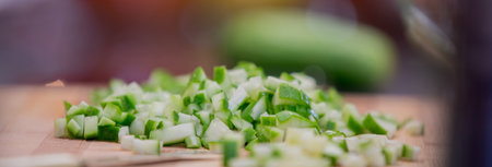 sliced cucumbers on board in the kitchenの写真素材