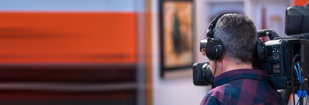 professional cameraman - covering on event with a videoの写真素材