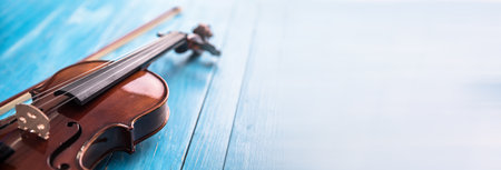 violin on the blue wooden table background