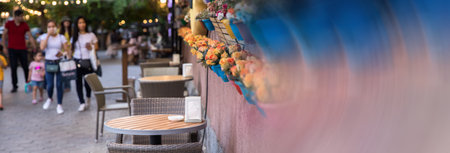 tables and chairs in cafe in streetの写真素材