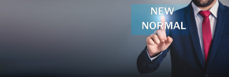 man touching new normal in the screenの写真素材