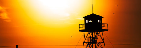 fire lookout tower at the sunset backgroundの写真素材