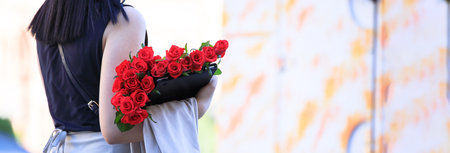 woman hand roses in the streetの写真素材