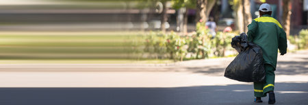 worker garbage man in the street backgroundの写真素材