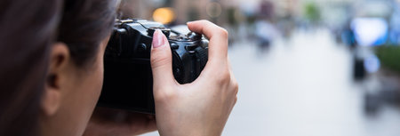 woman hand camera in the street backgroundの写真素材