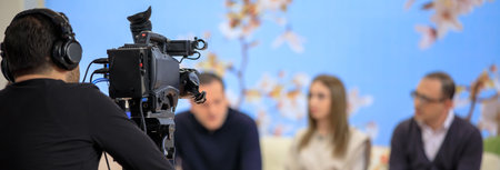 Man and woman on set for a TV interview