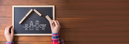 woman hand cubes and family in chalkboardの写真素材