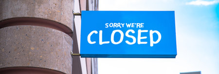sorry we're closed sign in street building