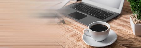 cup of coffee with computer on the working tableの写真素材