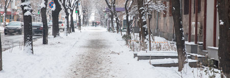 Snowy road in winter in the cityの写真素材