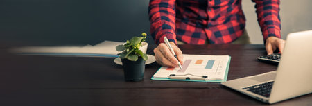 business man working in graph in working table