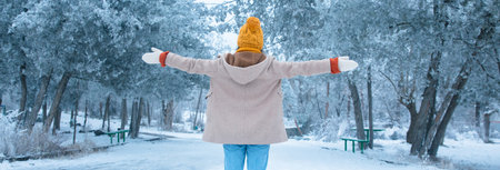 happy woman in snowy park background