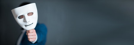 business man holding white maskの写真素材