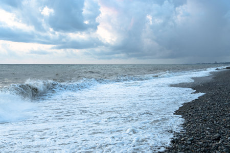 Seashore in the evening on a cloudy dayの写真素材
