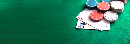 Pair of aces with poker chips on the poker table