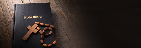cross on Holy Bible on the table