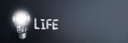 light bulb with life text on boardの写真素材