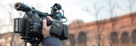 Camera man is making video in street