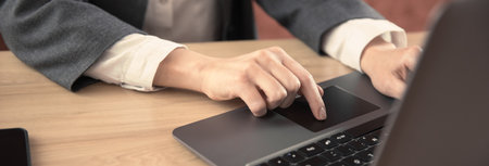 woman working in notebook in office desk