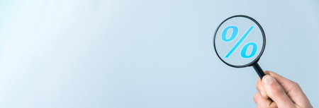 man holding magnifier with sale signの写真素材