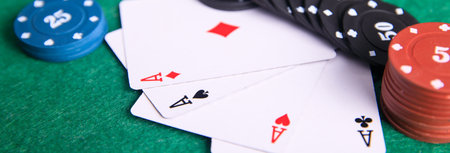 aces with poker chips on tableの写真素材