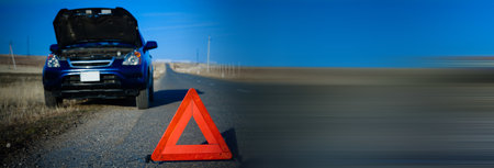 Red triangle of a car on the road.